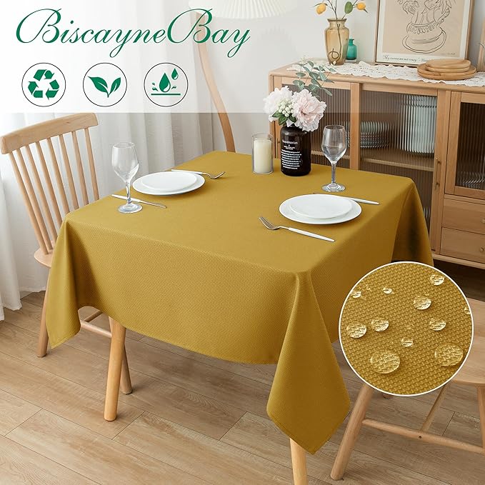 Biscaynebay Textured Fabric Square Christmas Tablecloths 54x54 Inches, Gold Water Resistant Spill Proof Tablecloths for Dining, Kitchen, Wedding and Parties, etc. Machine Washable